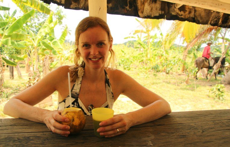 Drinking sugar cane juice, with rum of course!