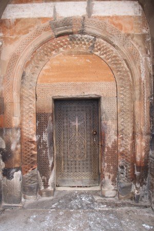 Detailed door with wood carving and stone carving